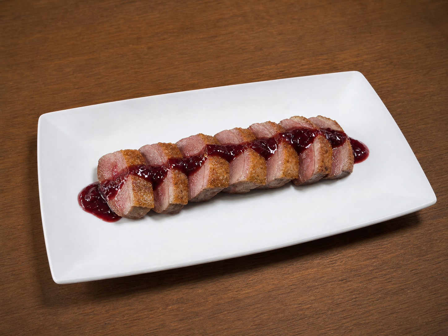 Peladilla de pato con salsa de frutos rojos